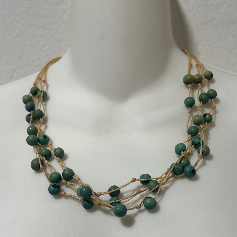 Elegant Beaded Necklace with Green Accents